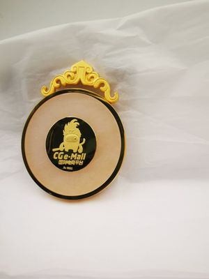 Oval light gold award medallion with ornate gold hanger and black mascot emblem