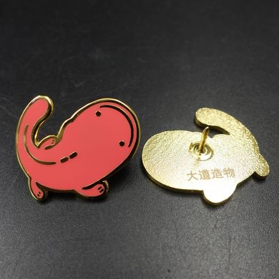 Red cartoon elephant lapel pin with black outlines beside its gold rear clutch and Chinese marking