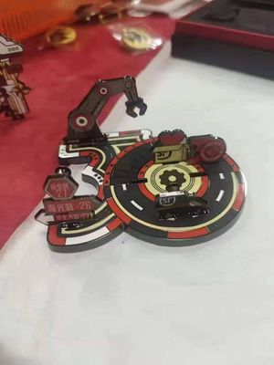Industrial robot arm illustration on an irregular red and black metal emblem with mechanical round base