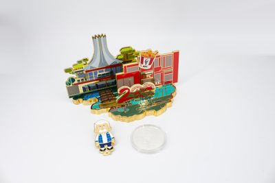 City anniversary scenic souvenir with separate miniature cartoon mascot displayed below