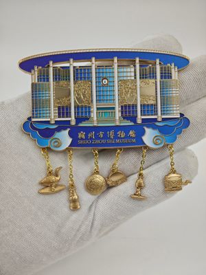 Blue and gold curved roof landmark souvenir with five small dangling charms