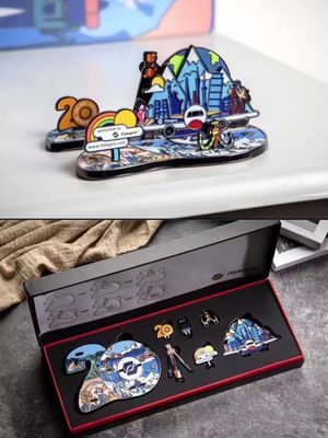 Colorful city landmark anniversary souvenir shown above a red lined presentation gift box
