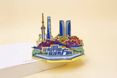 Colorful miniature city skyline souvenir with tall towers and Chinese text on blue base