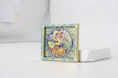 Square blue and gold dragon souvenir magnet with turquoise decorative border