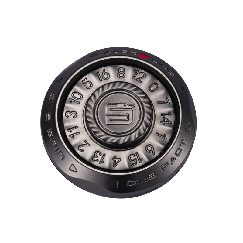 Round black metal fidget toy with numbered dial and circular center